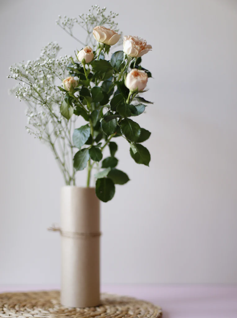 Close up of soft pink Old Roses with densely layered petals and vintage charm
